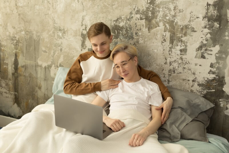 gay couple watches a movie